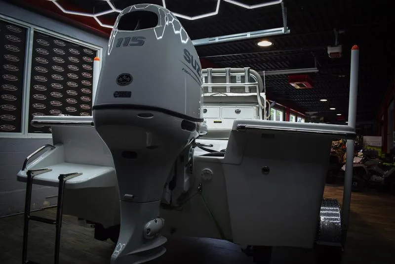 Slide: The Image of 2023 Savannah SS19 boat with 115 horsepower Suzuki outboard motor in showroom. - 4