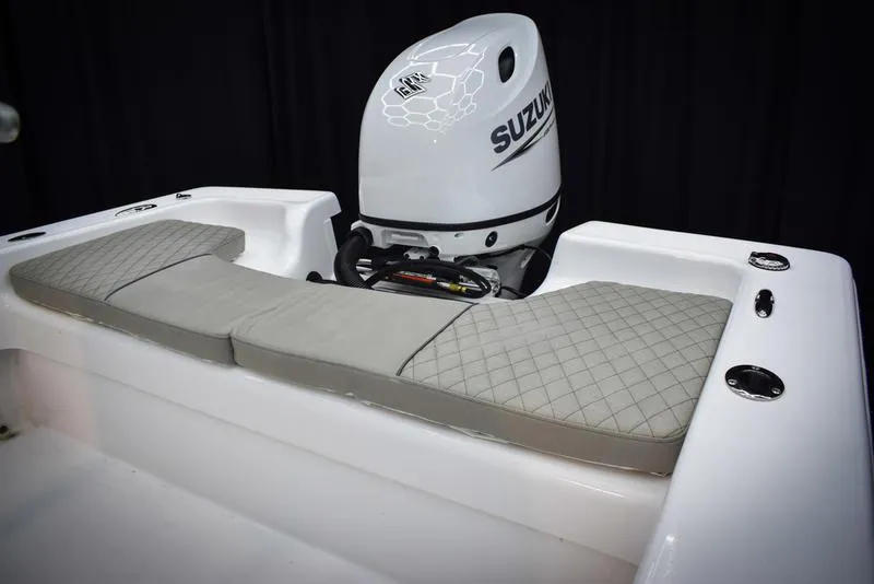 Slide: The Image of 2023 Savannah SS19 boat with Suzuki outboard motor and cushioned seating. - 8