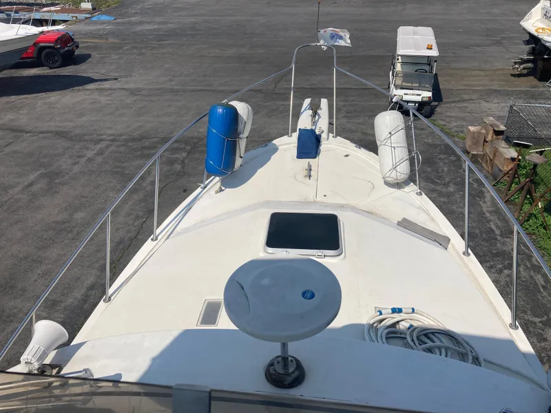 Slide: The Image of 1984 Bayliner 3270 Command Bridge boat deck with safety equipment and accessories. - 13