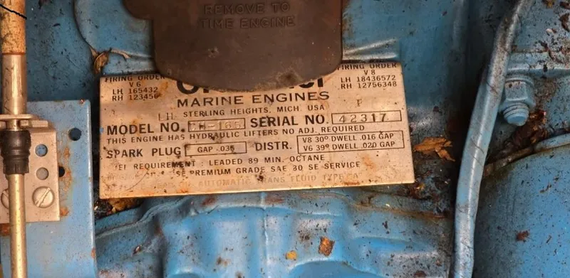 Slide: The Image of 1984 Bayliner 3270 Command Bridge engine label, showing specifications and maintenance details. - 17