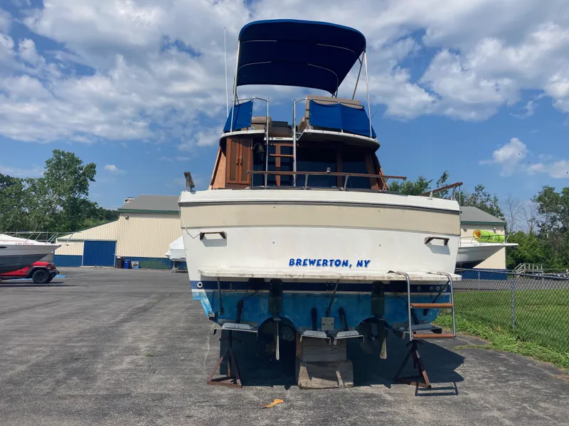 Slide: The Image of 1984 Bayliner 3270 Command Bridge boat on dry dock in Brewerton, NY. - 2