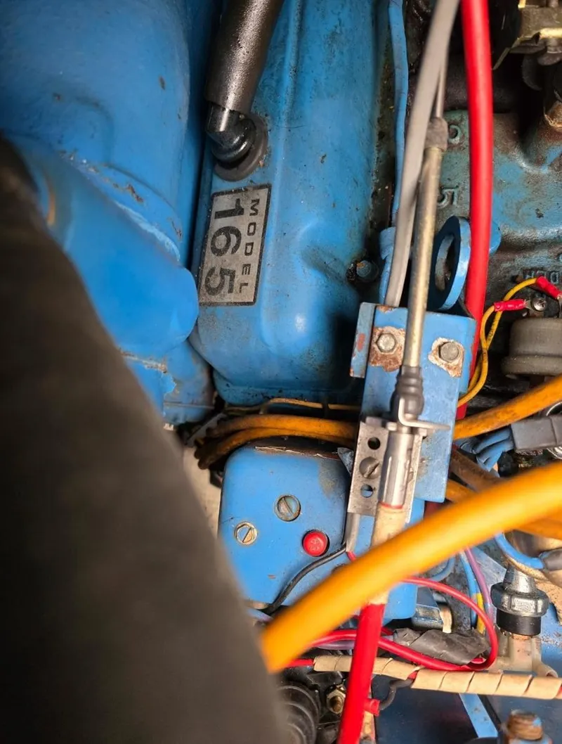 Slide: The Image of Engine components of a 1984 Bayliner 3270 Command Bridge, featuring Model 165 label. - 28