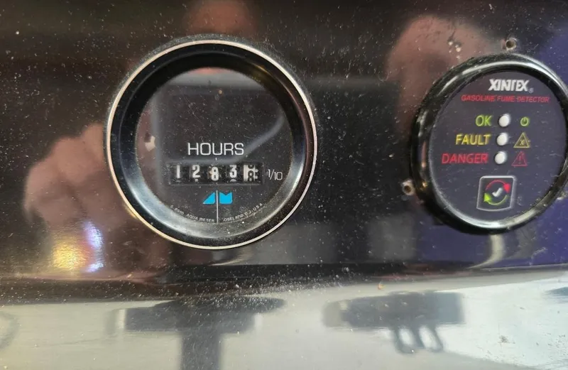Slide: The Image of Hour meter and indicator panel on 1984 Bayliner 3270 Command Bridge. - 30