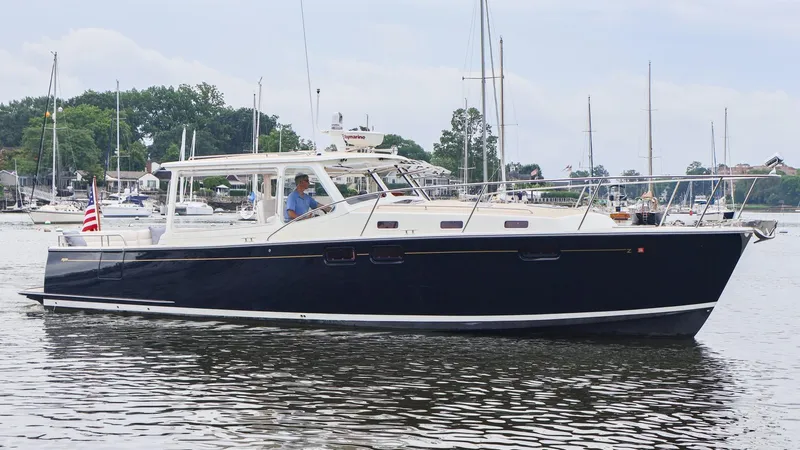 The Image of 2010 MJM 40z Downeast yacht cruising in a marina. - 0