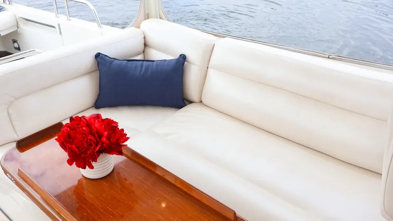 Slide: The Image of Luxurious seating area on 2010 MJM 40z Downeast boat with red flowers and blue pillow. - 12