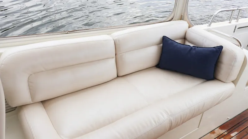 Slide: The Image of Luxurious white leather seating on 2010 MJM 40z Downeast boat with navy cushion. - 13
