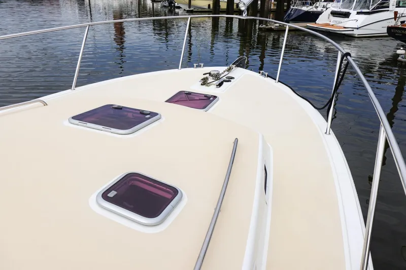 Slide: The Image of 2010 MJM 40z Downeast boat deck with hatches and railing in marina. - 3