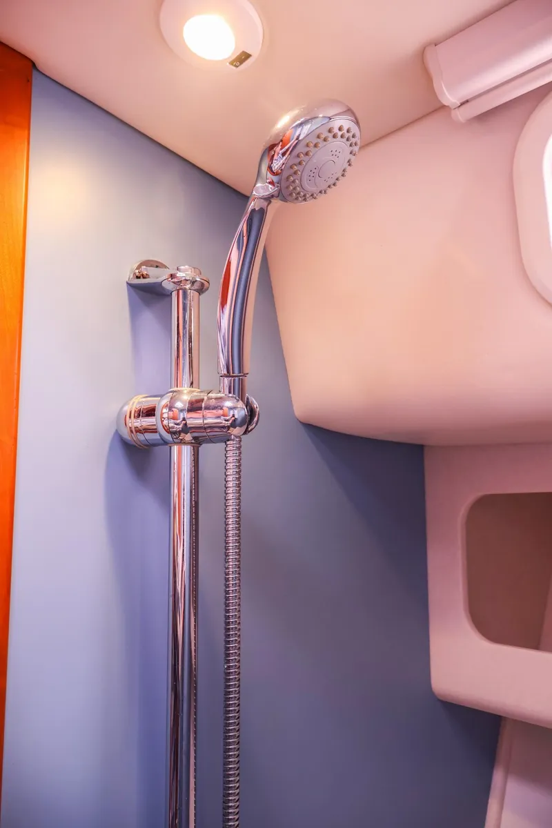 Slide: The Image of 2010 MJM 40z Downeast yacht shower with chrome fixtures and blue wall. - 30