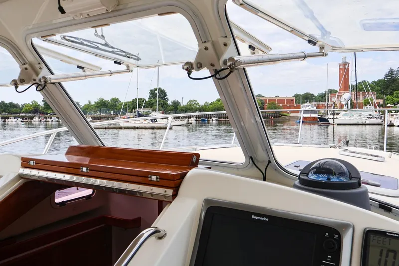 Slide: The Image of View from the helm of a 2010 MJM 40z Downeast boat in a marina. - 7