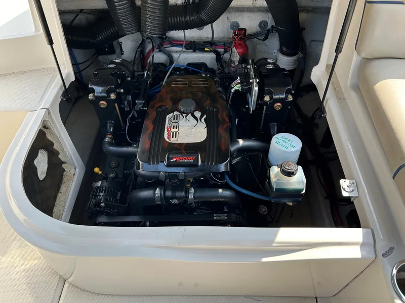Slide: The Image of Engine compartment of a 2007 Sea Ray 240 Sundeck boat, showcasing the motor and components. - 14