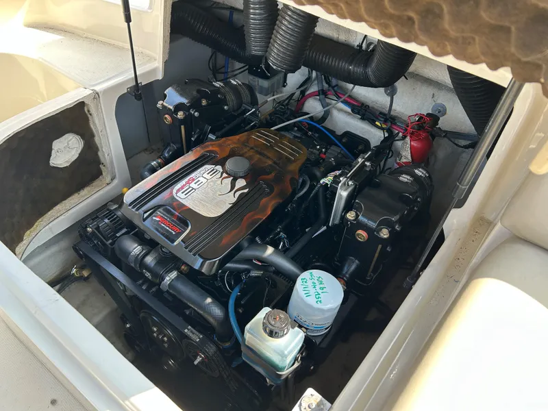 Slide: The Image of 2007 Sea Ray 240 Sundeck engine compartment with visible components and wiring. - 16