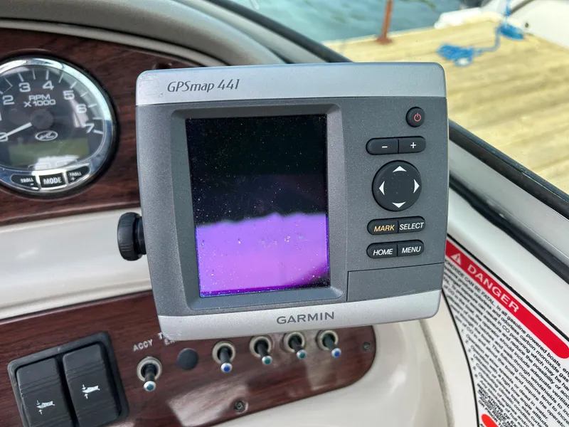 Slide: The Image of Garmin GPSmap 441 on 2007 Sea Ray 240 Sundeck dashboard, near water. - 8