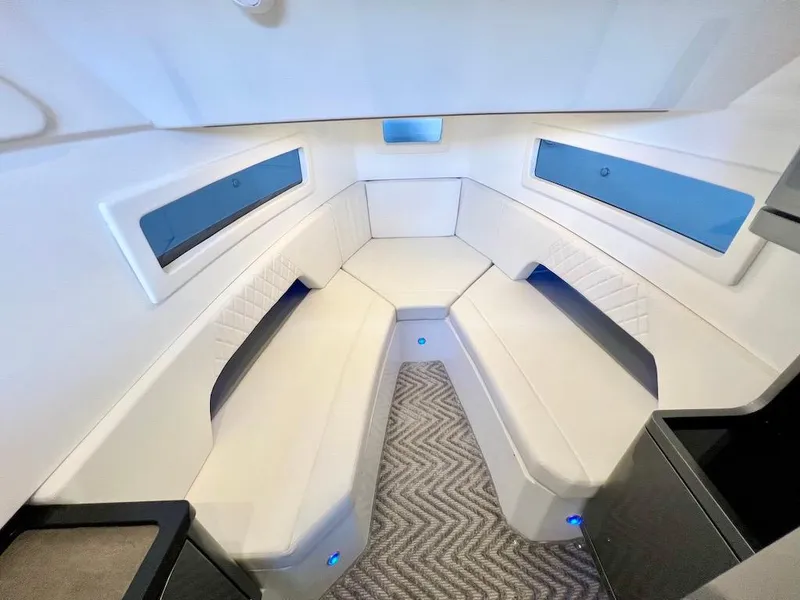 Slide: The Image of Luxurious interior of the 2025 Schaefer V33 yacht with white seating and modern design. - 21
