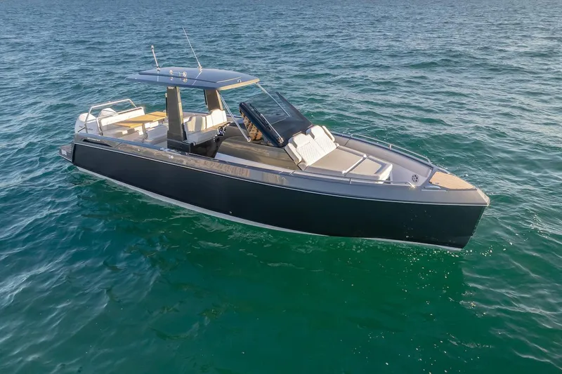 Slide: The Image of 2025 Schaefer V33 boat cruising on open water. - 27