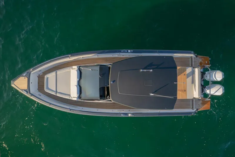 Slide: The Image of Top view of 2025 Schaefer V33 boat on green water. - 3