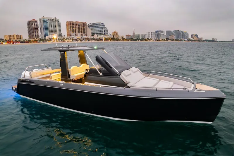 Slide: The Image of 2025 Schaefer V33 boat on water with city skyline in background. - 31