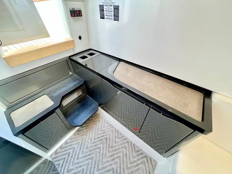 Slide: The Image of Modern interior of 2025 Schaefer V33 yacht with sleek cabinetry and countertop. - 23