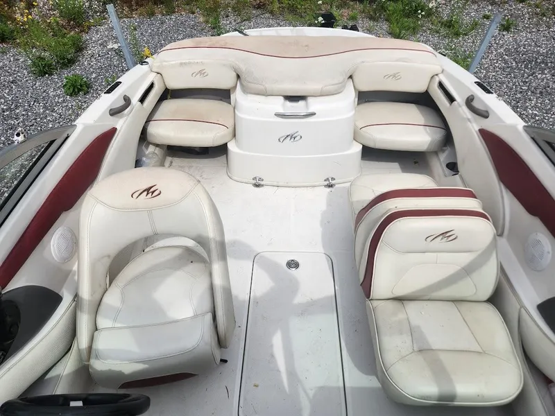 Slide: The Image of 2007 Monterey 180 FS boat interior with white and red seating. - 3