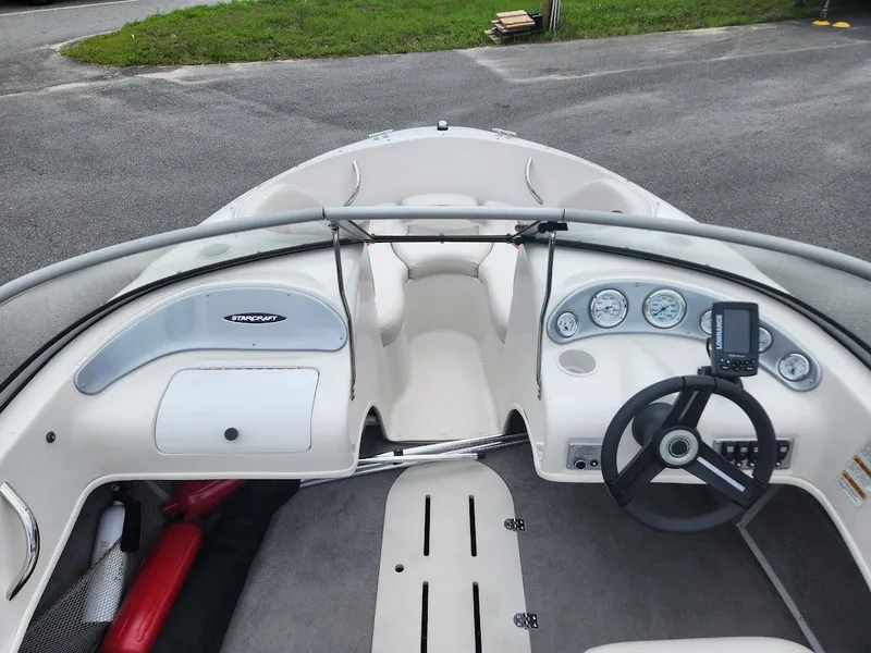 Slide: The Image of 2007 Starcraft 1700 Limited boat interior with steering wheel and dashboard. - 4