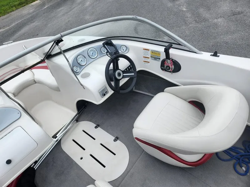 Slide: The Image of 2007 Starcraft 1700 Limited boat interior with steering wheel and seating. - 5