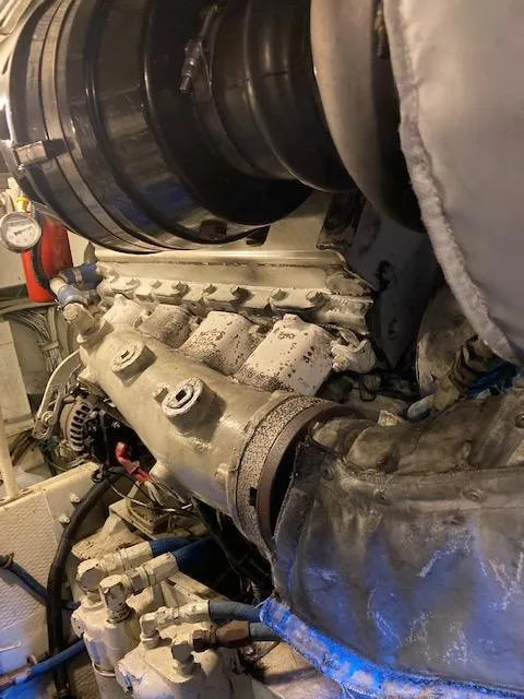 Slide: The Image of Close-up of 1987 Viking Convertible engine components in a boat's engine room. - 7