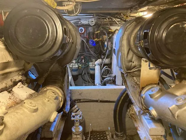 Slide: The Image of Engine room of a 1987 Viking Convertible boat with visible machinery and components. - 9