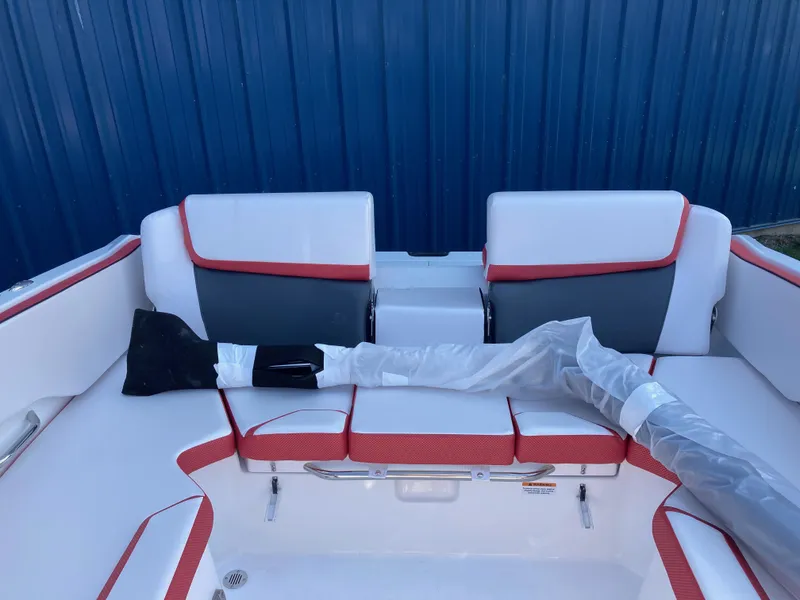 Slide: The Image of 2024 Scarab 215 boat interior with red and white seating. - 4