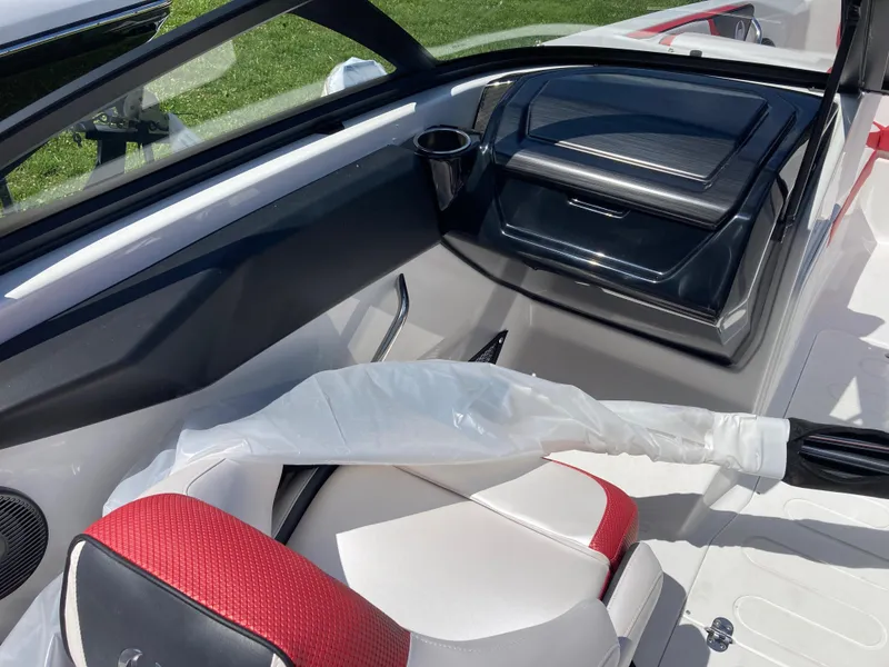 Slide: The Image of Interior of 2024 Scarab 215 boat with red and white seating. - 5