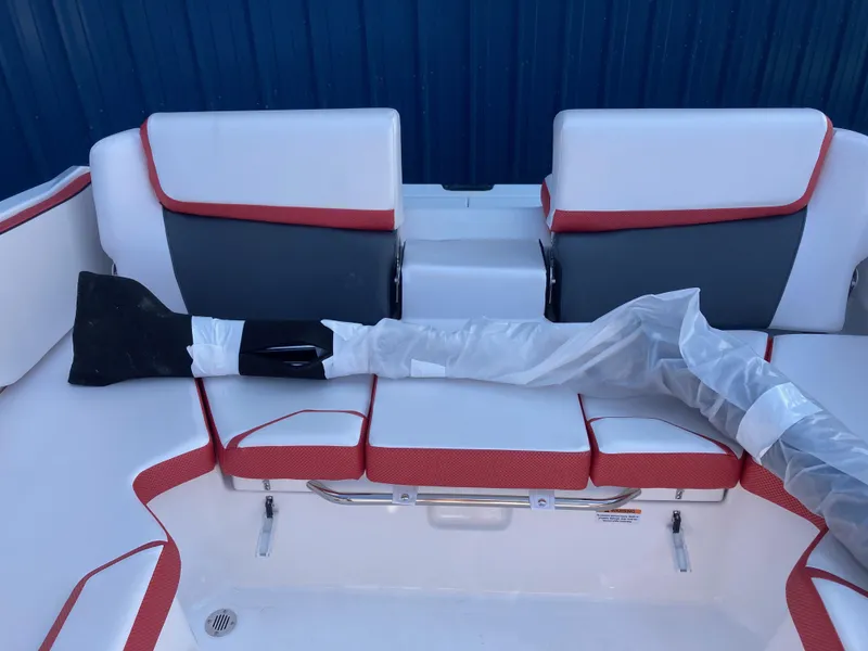 Slide: The Image of 2024 Scarab 215 boat interior with white and red seating. - 8