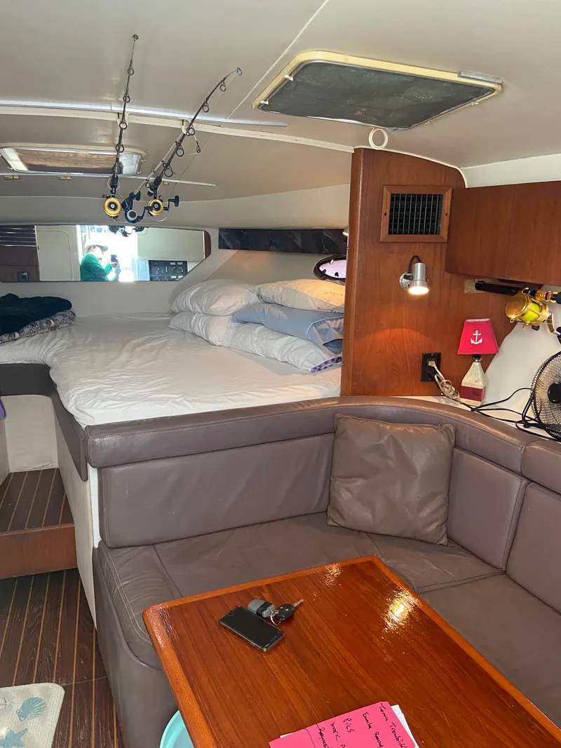 Slide: The Image of Interior cabin of a 1992 Tiara Yachts 31 Open with bed and seating area. - 24