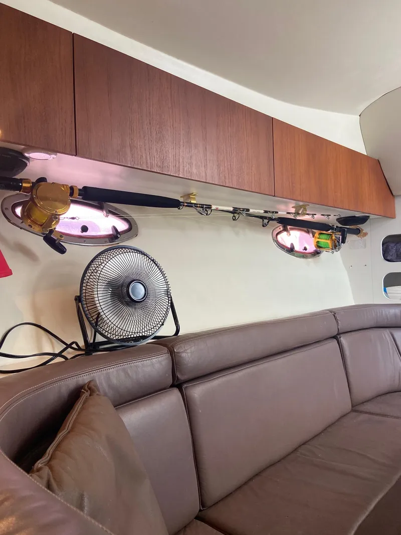 Slide: The Image of Interior of 1992 Tiara Yachts 31 Open with leather seating and storage cabinets. - 26