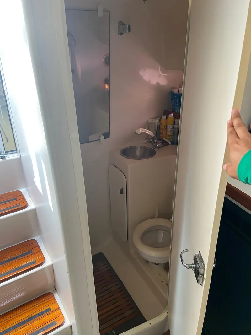 Slide: The Image of 1992 Tiara Yachts 31 Open bathroom with sink and toilet. - 34