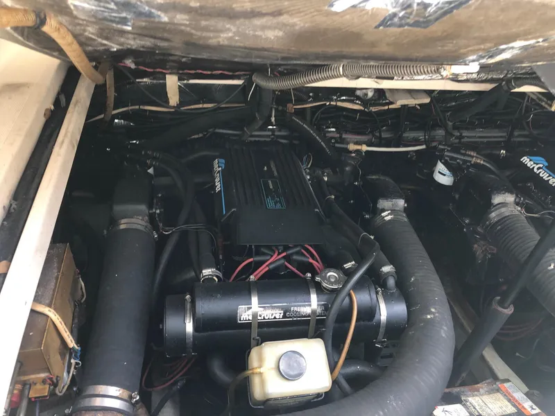 Slide: The Image of 1992 Tiara Yachts 31 Open engine compartment with MerCruiser components. - 40