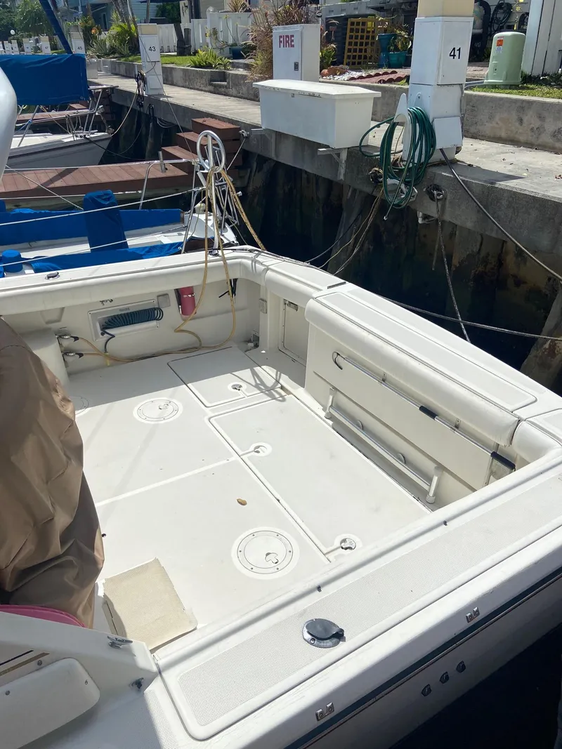 Slide: The Image of 1992 Tiara Yachts 31 Open at dock, spacious deck area. - 7