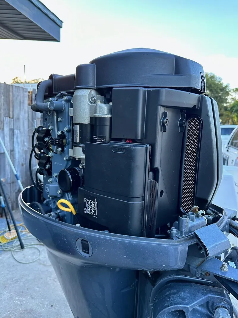 Slide: The Image of Close-up of a 1988 Mako 171 Center Console outboard motor. - 10
