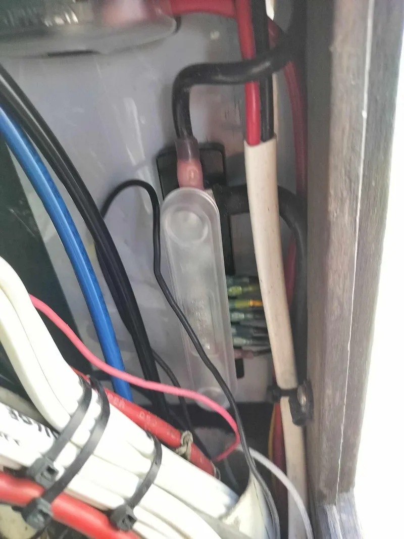 Slide: The Image of Wiring and fuse box inside a 1988 Mako 171 Center Console boat. - 16