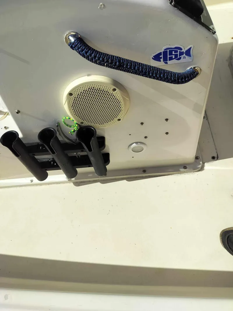 Slide: The Image of 1988 Mako 171 Center Console boat with rod holders and speaker. - 17