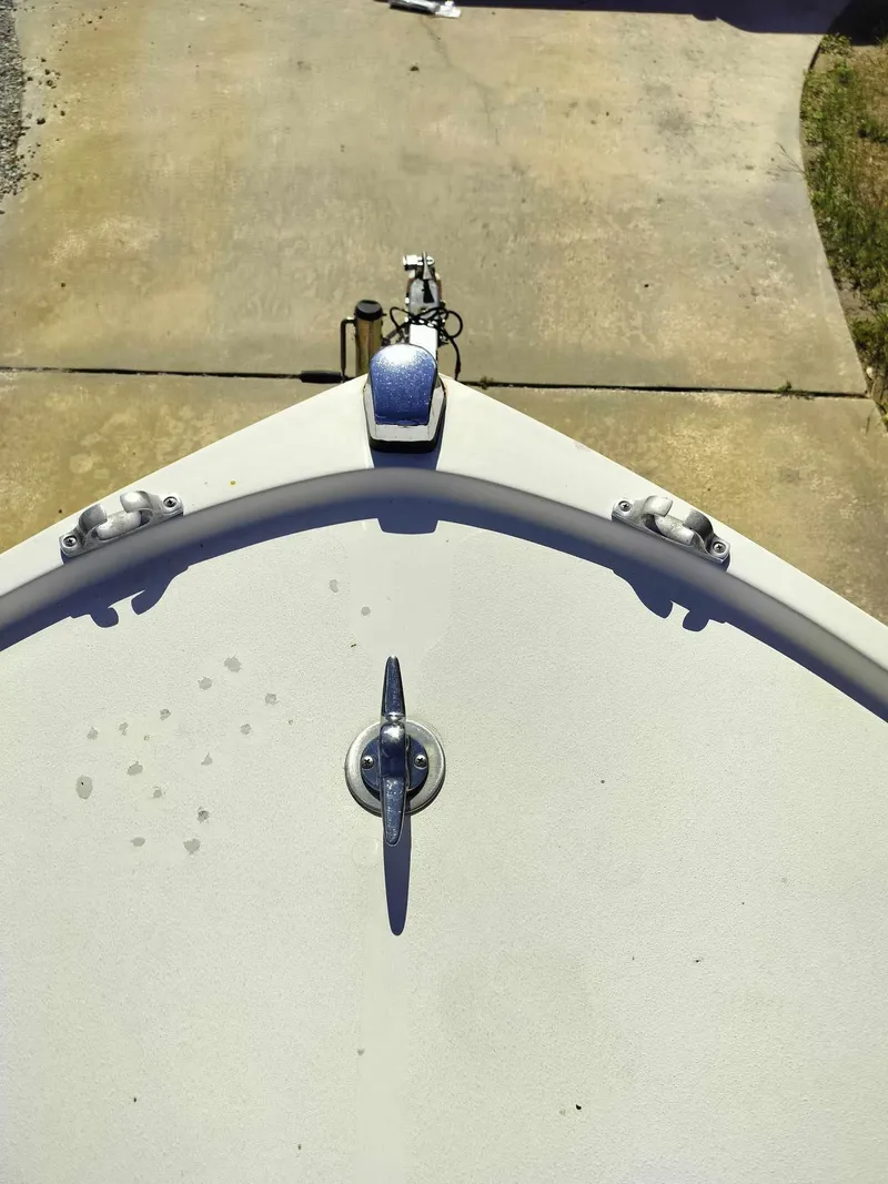 Slide: The Image of 1988 Mako 171 Center Console boat bow on trailer. - 19