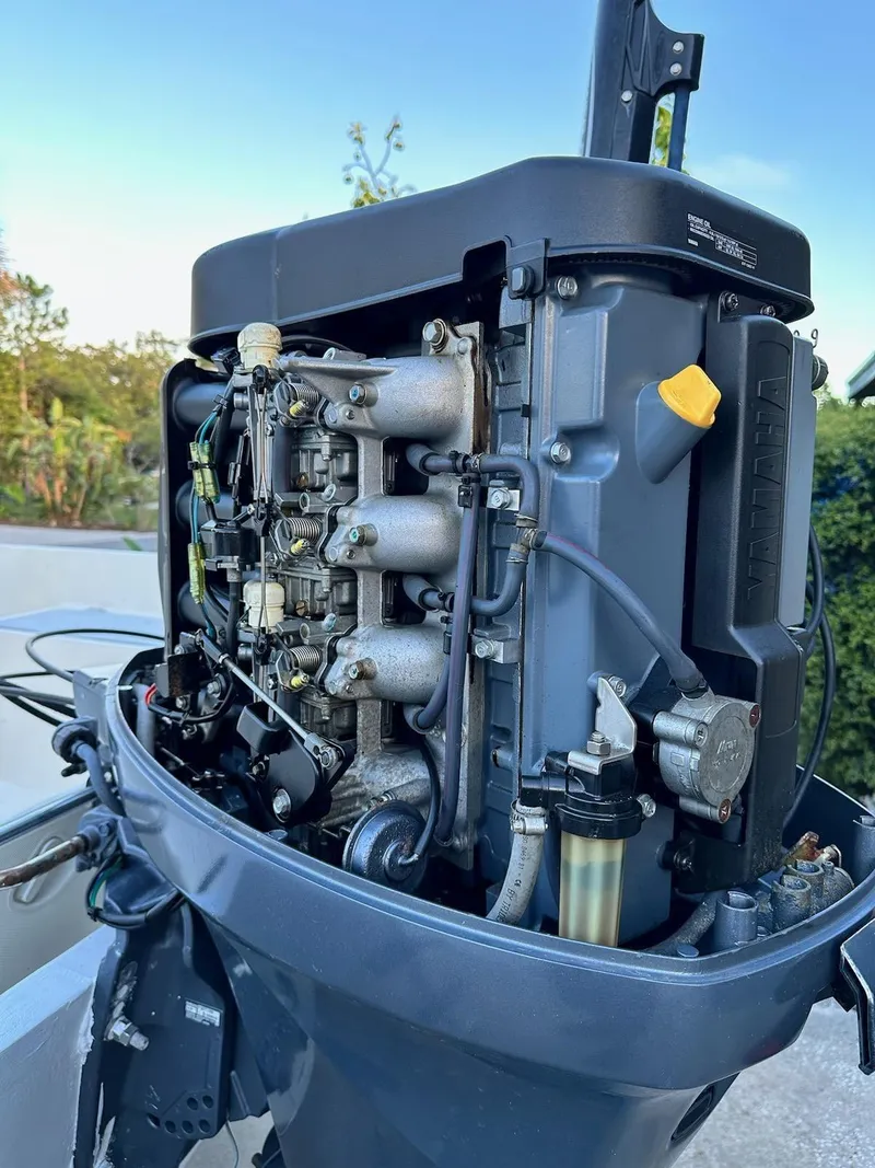 Slide: The Image of Close-up of a 1988 Mako 171 Center Console outboard motor engine. - 30