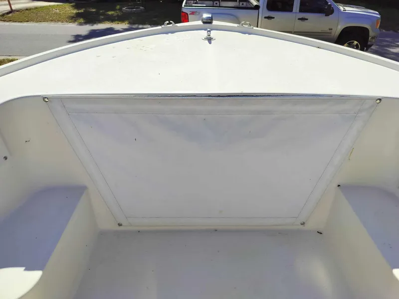 Slide: The Image of 1988 Mako 171 Center Console boat bow with storage compartment. - 38