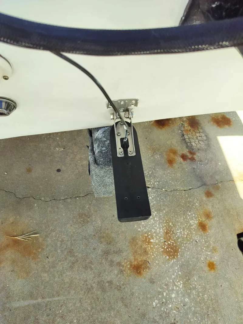 Slide: The Image of 1988 Mako 171 Center Console boat with transducer mounted on the hull. - 42