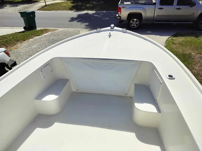 Slide: The Image of 1988 Mako 171 Center Console boat interior with seating and storage compartments. - 46