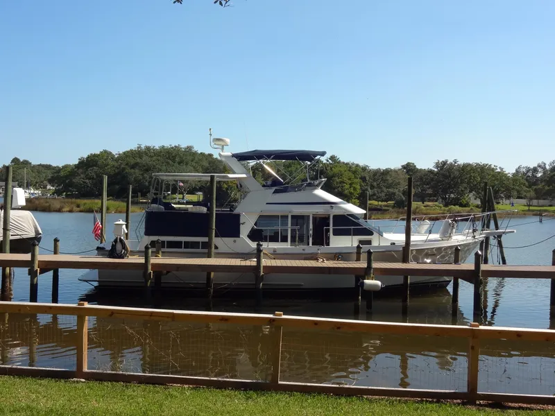 Slide: The Image of 1986 Tollycraft 44 CPMY yacht docked on a sunny day. - 3