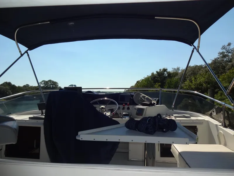 Slide: The Image of 1986 Tollycraft 44 CPMY yacht cockpit with canopy and steering wheel. - 31