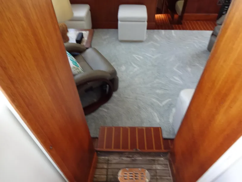 Slide: The Image of Interior of 1986 Tollycraft 44 CPMY yacht with carpet and wooden accents. - 39