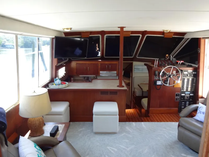Slide: The Image of Interior of 1986 Tollycraft 44 CPMY yacht with helm, seating, and large windows. - 40