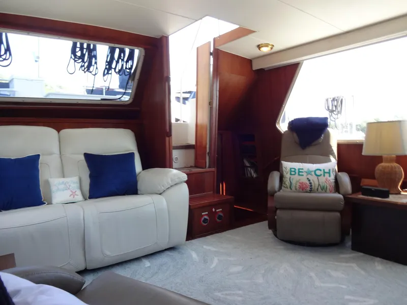 Slide: The Image of Interior of 1986 Tollycraft 44 CPMY yacht with cozy seating and nautical decor. - 46