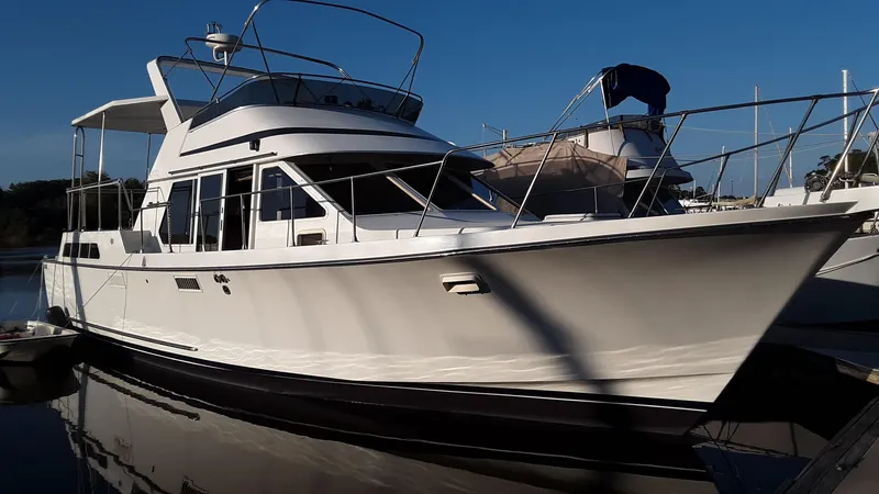 Slide: The Image of 1986 Tollycraft 44 CPMY yacht docked in marina, side view. - 5