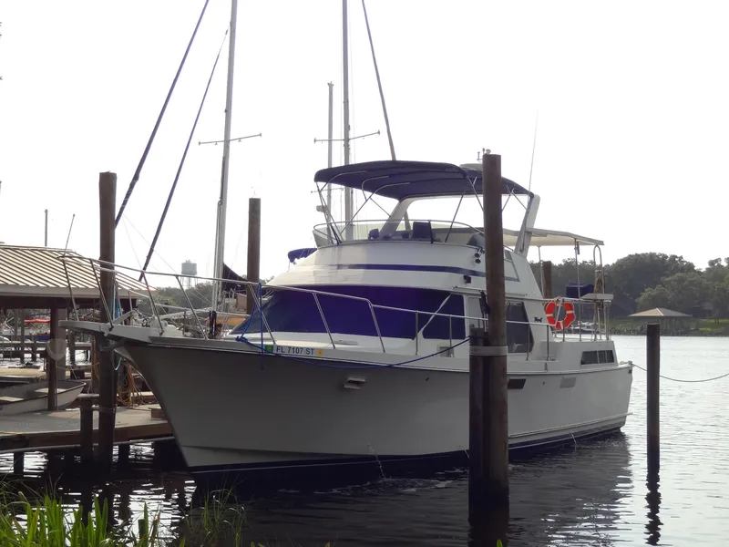 Slide: The Image of 1986 Tollycraft 44 CPMY yacht docked at marina, side view. - 7