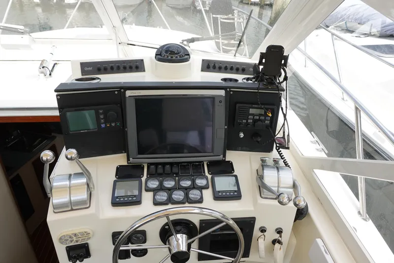 Slide: The Image of Control panel of a 2002 Carolina Classic 35 boat with navigation equipment. - 25